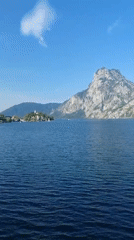 Traunkirchen lakeside and mountain road on a clear summer day