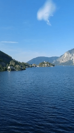 Traunkirchen lakeside and mountain road on a clear summer day