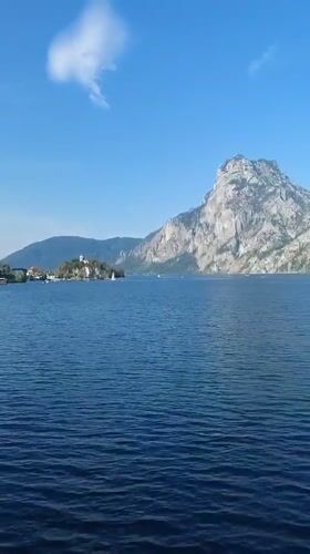 Traunkirchen lakeside and mountain road on a clear summer day