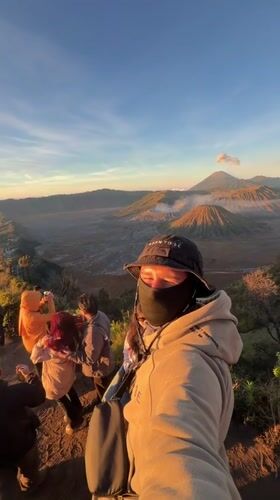 Sunrise crowd at a volcanic viewpoint in Cemorolawang, Indonesia