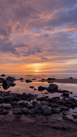 Golden sunset captured along Ķurmrags beach in Latvia