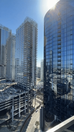Downtown LA skyline and a studio conversation, mid-afternoon.