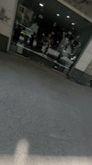 Person records walk past Hotel Kastoria in Thessaloniki