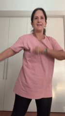 Woman dances indoors in San Isidro, Peru residential setting