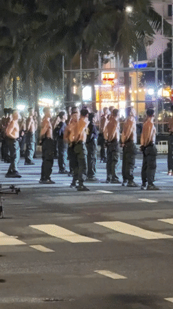 Nighttime street event in Đà Nẵng mixes drill routines, drones, and crowd activity