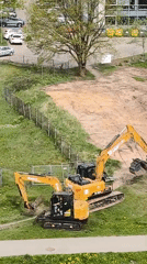 Construction excavators parked at worksite in Riga