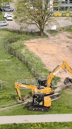 Construction excavators parked at worksite in Riga