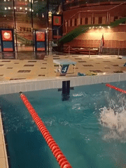 Swimmer captured in pool with orange lanes in Chaykovsky