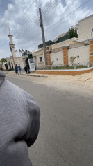 Person films from moving vehicle near mosque in Kaduna