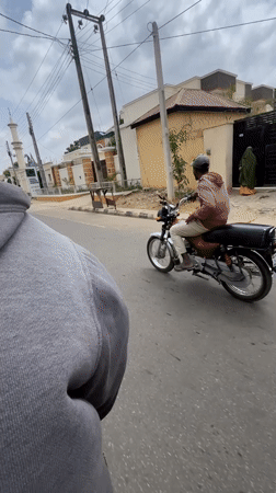 Person films from moving vehicle near mosque in Kaduna