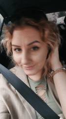 Woman in blazer observed seated in car in Istanbul