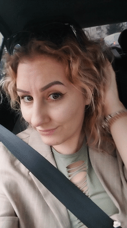Woman in blazer observed seated in car in Istanbul