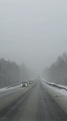 Driver documents snowy highway conditions near Chaykovsky, Russia