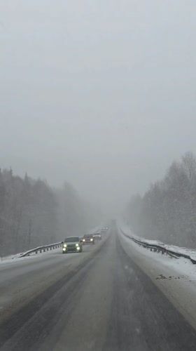 Driver documents snowy highway conditions near Chaykovsky, Russia