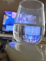 Glass of water with blue light glow, Petah Tikva
