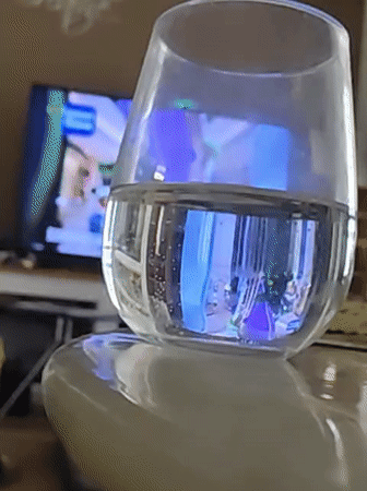 Glass of water with blue light glow, Petah Tikva
