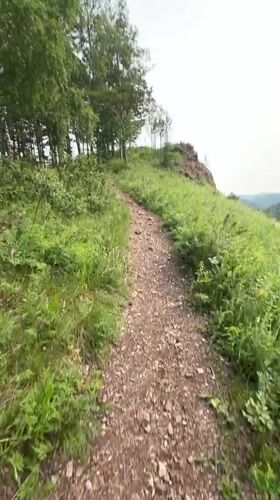 Hiking rocky forested hills above a Krasnoyarsk valley