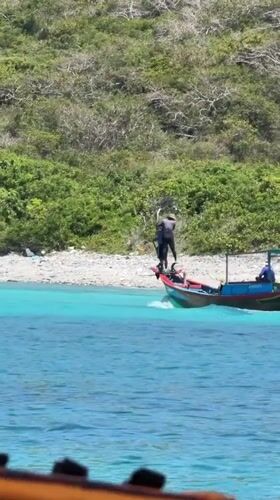 Longtail boat with three passengers spotted off Nha Trang coast