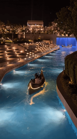Gondolas and waterfalls light up a Sharm El Sheikh canal at night