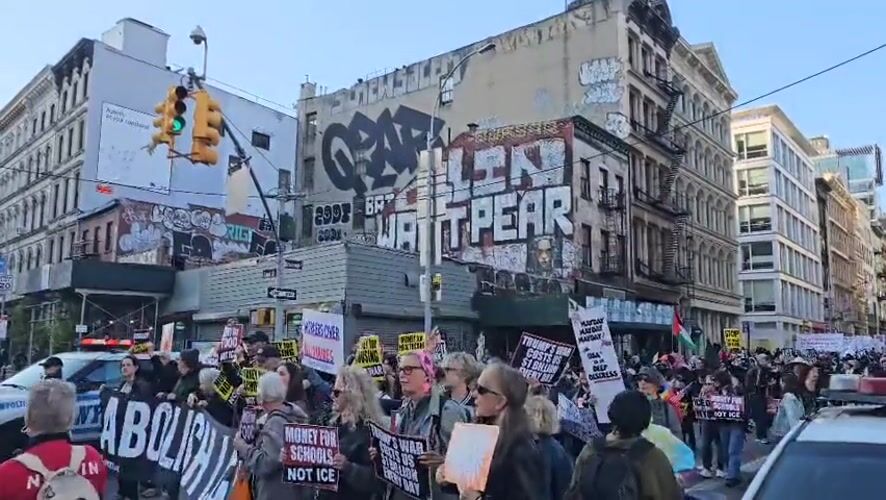 Political protesters march through NYC streets with police presence