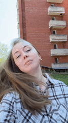 Woman poses with chocolate bars in casual outdoor photo session
