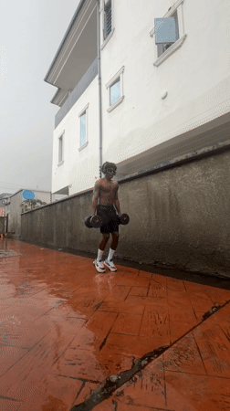 Outdoor dumbbell workout in Igboefon tied to a sports challenge