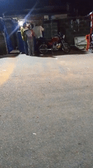 Late-night street commerce and socializing documented in Lokoja, Nigeria