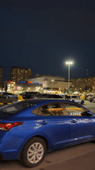 Dusk street life outside a Moscow residential complex