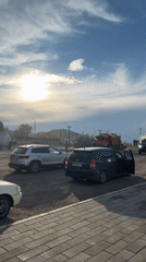 Airboat on trailer parked alongside vehicles in Turan