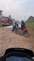 Fire truck and foam on a dirt road in Samarinda