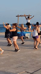 Outdoor dance fitness class on the Quarteira waterfront