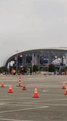 Parking lot outside SoFi Stadium on an overcast afternoon