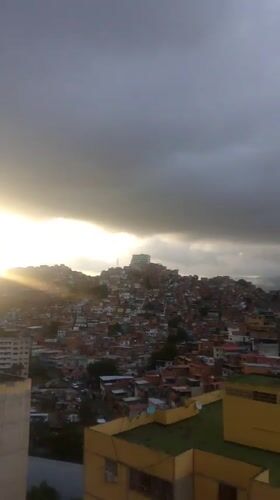 Caracas hillside neighborhoods at dusk, multiple angles