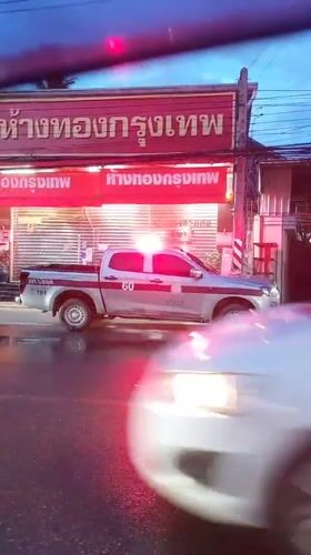 Koh Samui street scenes: police presence, rain, and local traffic