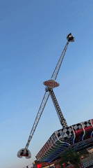 Amusement park rides operating during evening hours in Varna