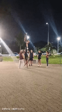 Caracas residents enjoy evening activities in illuminated public park