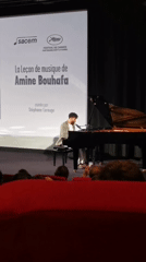 Amine Bouhafa piano event filmed at theater auditorium