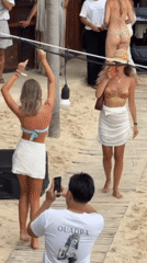 Beach club gathering in white attire, South Kuta