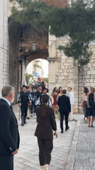 Traditional musicians perform on Dubrovnik's medieval walls for tourists