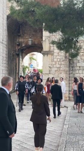 Traditional musicians perform on Dubrovnik's medieval walls for tourists
