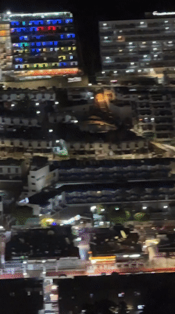 Mogán's residential sprawl glows at night from above