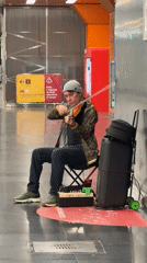 Violinist busks in Moscow metro station