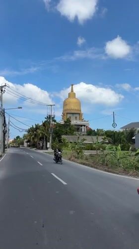 Early morning motorcycle traffic observed on Mengwi road