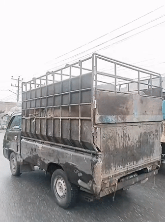 Rainy day transportation and construction activity in Indonesian towns