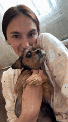Woman shares tender moment with small dog in Sochi