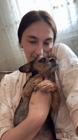 Woman shares tender moment with small dog in Sochi