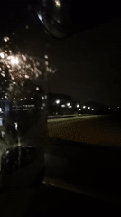 Night drive through rainy streets in Leudelange, Luxembourg