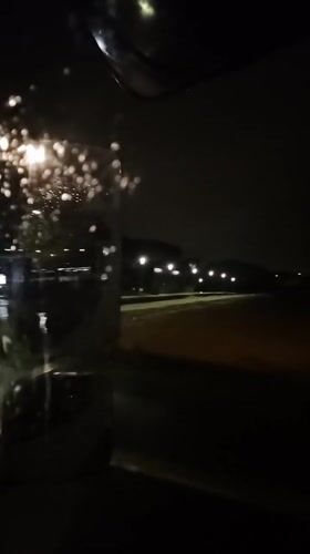 Night drive through rainy streets in Leudelange, Luxembourg