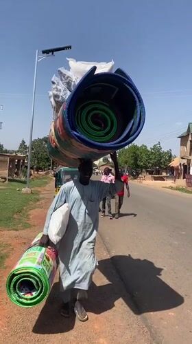 Cattle herd shares roads with daily life in Vom, Nigeria