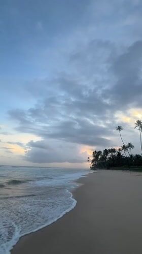 Sri Lankan beaches witness dramatic sunset through storm clouds